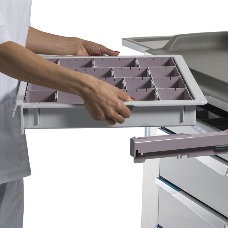 a nurse removes an FH-Drawer from a medication trolley