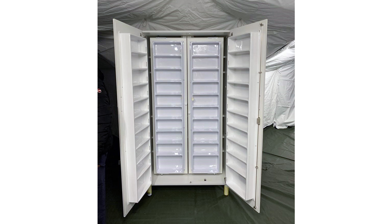 a medication cabinet inside the tent of a NATO field hospital