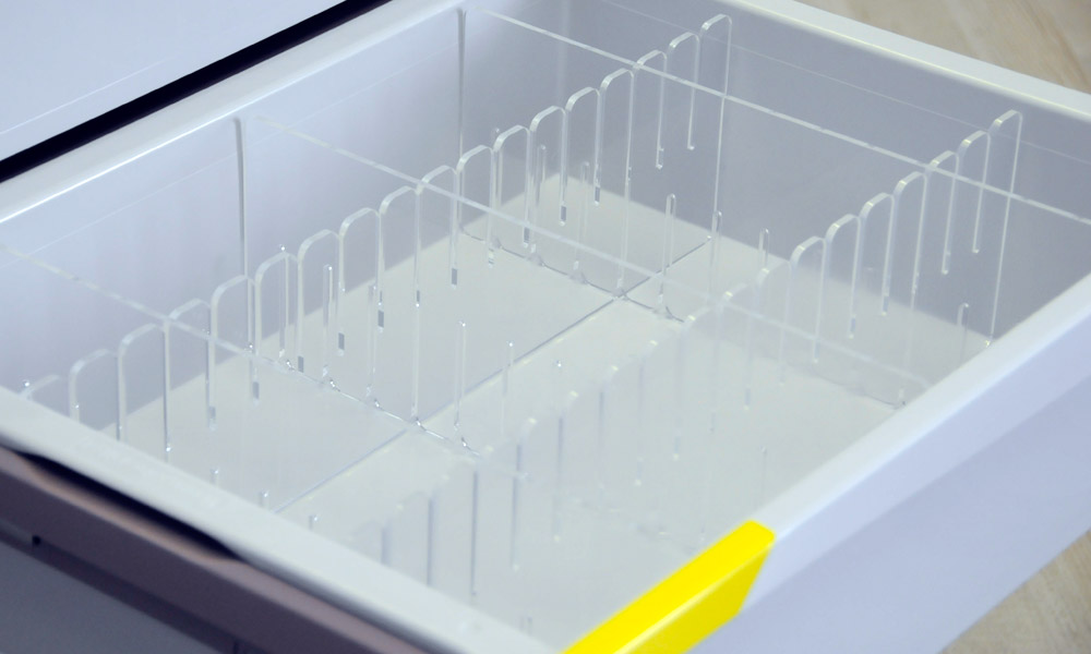 a drawer of a medical trolley with slot-in dividers to better organise the available space